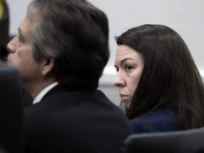 Jessy Kurczewski, right, listens as Waukesha County Judge Jennifer Dorow addresses a question the jury asked while in deliberations, next to defence attorney Pablo Galaviz, during her trial at the Waukesha County Courthouse in Waukehsa, Wis., Monday, Nov. 13, 2023.