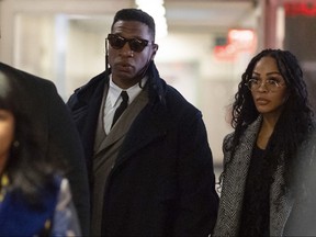 Actors Jonathan Majors, centre, and Meagan Good, right, arrive at court for a jury selection on Major's domestic violence case on Wednesday, Nov. 29, 2023, in New York City.