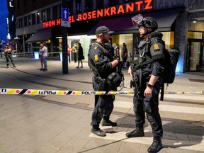 Police secure the area after a shooting in Oslo, Norway, early Saturday, June 25, 2022.