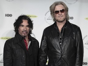 Hall of Fame Inductees, Hall & Oates, John Oates and Daryl Hall appear in the press room at the 2014 Rock and Roll Hall of Fame Induction Ceremony on April, 10, 2014, in New York.
