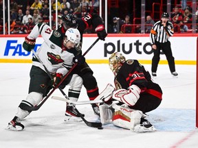 Wild forward Brandon Duhaime can't find a way to squeeze the puck past Senators goaltender Anton Forsberg on a scoring attempt in Saturday's game in Stockholm