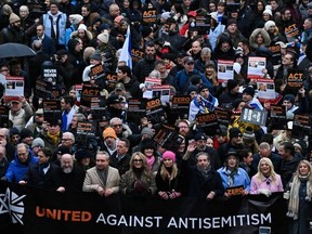 Protesters holding placards take part in a demonstration in central London, on November 26, 2023, to protest against antisemitism.