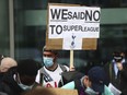 Tottenham fans stage a protest against the Board over the planned creation of a European Super League, outside the Tottenham Hotspur Stadium in London, England, Wednesday, April 21, 2021. Over two fraught days in April 2021 a newly-formed "Super League" threatened to change the face of European soccer by creating an elite tournament that would effectively be a closed shop for 15 of the richest clubs in the world. It collapsed amid a furious backlash from fans and on Tuesday, Nov. 7, 2023, King Charles announced a U.K. government bill that would have the power to block teams from attempting to join a breakaway league in the future.