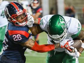Montreal Alouettes' Tyrice Beverette (26) tackles Saskatchewan Roughriders' Tevin Jones (14) during second half CFL football action in Montreal, Friday, Aug. 11, 2023. Beverette was among six Alouettes named to the CFL's East Division all-star team.