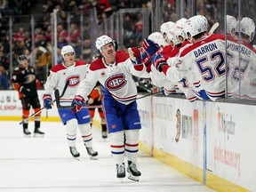 Montreal Canadiens center Alex Newhook is congratulated for his second goal during the third period against the Anaheim Ducks in an NHL hockey game Wednesday, Nov. 22, 2023, in Anaheim, Calif.