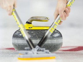 The Grand Slam of Curling has changed course after some of the sport's top players shared concerns about recent format changes on the five-event circuit. Curlers sweep a rock during in Brandon, Man., on March 5, 2019.