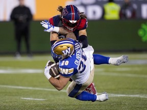 Alouettes safety Marc-Antoine Dequoy says his passionate French speech after Montreal won the Grey Cup on Sunday was nothing against English people. Winnipeg Blue Bombers running back Brady Oliveira (20) is tackled by Dequoy (24) during the second half of football action at the 110th CFL Grey Cup in Hamilton, Ont., on Sunday, November 19, 2023.