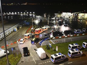 Police vehicles and ambulances arrive at the scene of a security breach at the Hamburg Airport, Saturday, Nov. 4, 2023, in Hamburg, Germany.