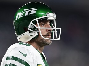 FILE - New York Jets quarterback Aaron Rodgers warms up before playing against the Buffalo Bills in an NFL football game, Sept. 11, 2023, in East Rutherford, N.J. Rodgers spoke to local reporters Thursday, Nov. 30, and said he's not yet close to being able to play after tearing his left Achilles tendon four snaps into his debut with the Jets on Sept. 11. But he also left open the door for him to be back under center before his initial goal of Dec. 24, saying he plans to ramp up his practice activities next week.