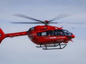 A STARS air ambulance crew arrives at the base in Calgary on Friday, March 25, 2022.