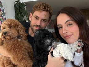Nick Viall, Natalie Joy and their two dogs.