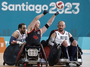 Zak Madell of Okotoks, Alta., scored 30 of his team's 46 tries as Canada surged into the wheelchair rugby semifinals at the 2023 Parapan Am Games with a 46-41 win over the archrival United States on Tuesday. Madell (33) passes the ball during wheelchair rugby mixed match 13 against the U.S.A., at the Santiago 2023 Parapan American Games, in Santiago, Chile, Tuesday, Nov. 21, 2023.