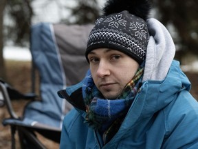 Non-binary Montrealer Alexe Frédéric Migneault, shown in Quebec City on Tuesday, Nov.21, 2023, is on day six of a hunger strike to pressure Quebec's public health insurance board to add a third gender option to its health cards.