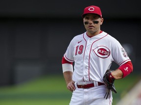 Cincinnati Reds' Joey Votto stands on the field during a game against the Pittsburgh Pirates in Cincinnati, Sunday, Sept. 24, 2023.