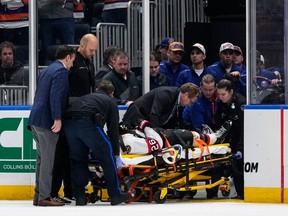 Ottawa Senators' Erik Brannstrom is carted off the ice after he was injured during the second period of the team's NHL hockey game against the New York Islanders on Thursday, Oct. 26, 2023, in Elmont, N.Y.