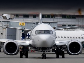 An Air Canada jet taxis at the airport, in Vancouver, B.C., Wednesday, Nov. 15, 2023.