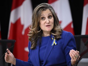 Deputy Prime Minister and Minister of Finance Chrystia Freeland speaks during a news conference on the next phase of the government's economic plan at the National Press Theatre in Ottawa, on Tuesday, Nov. 28, 2023. Freeland is pushing back against the idea that the federal government is wavering on its Jan. 1 timeline for implementing a new digital services tax.THE CANADIAN PRESS/Justin Tang