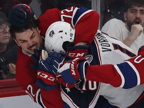 Canadiens' Arber Xhekaj gets into fight with Blue Jackets' Dmitri Voronkov during game in October at the Bell Centre.