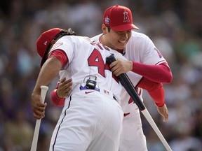 Shohei Ohtani of the Los Angeles Angeles, right, embraces Juan Soto, then of the Washington Nationals. in 2021.