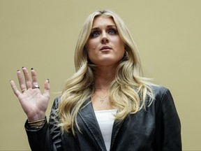 Former collegiate swimmer Riley Gaines is sworn in during a House Oversight Subcommittee.