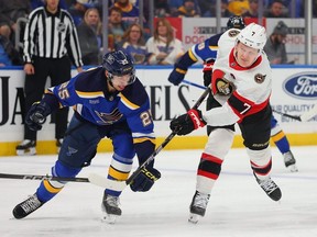Jordan Kyrou of the St. Louis Blues defends against Brady Tkachuk of the Ottawa Senators during the second period at Enterprise Center on Dec. 14, 2023 in St Louis.