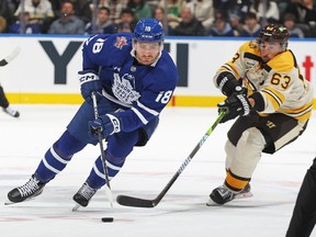 Brad Marchand of the Boston Bruins skates to check Noah Gregor of the Toronto Maple Leafs earlier this month.