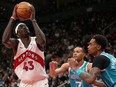Toronto Raptors forward Pascal Siakam eyes the basket under pressure from Charlotte Hornets guard Bryce McGowens (7) and teammate P.J. Washington (25).