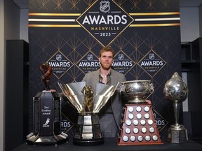 Connor McDavid of the Edmonton Oilers poses with the Ted Lindsay Award, Maurice Richard Trophy, Art Ross Trophy and the Hart Trophy during the 2023 NHL Awards at Bridgestone Arena on June 26, 2023 in Nashville, Tenn.
