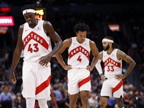 Pascal Siakam, from left, Scottie Barnes and Gary Trent Jr. of the Toronto Raptors walk up court during the first half of an exhibition game against the Cairns Taipans at Scotiabank Arena on Oct. 15, 2023 in Toronto.