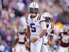 Jayden Daniels of the LSU Tigers celebrates a touchdown during the second half against the Texas A&M Aggies at Tiger Stadium on Nov. 25, 2023, in Baton Rouge, La.
