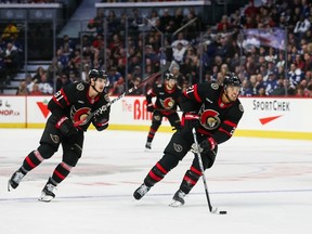 Mathieu Joseph of the Ottawa Senators skates with the puck against the Toronto Maple Leafs during the second period with his teammate Dominik Kubalik behind him at Canadian Tire Centre on Dec. 7, 2023 in Ottawa.