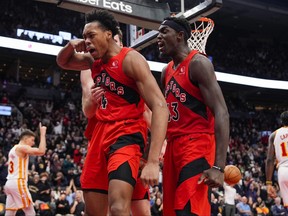 Scottie Barnes #4 of the Toronto Raptors celebrates with teammate Pascal Siakam #43 after making a basket against the Atlanta Hawks during second half NBA action at Scotiabank Arena on December 13, 2023 in Toronto.
