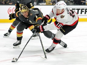 Tim Stutzle of the Ottawa Senators shoots against Alex Pietrangelo of the Vegas Golden Knights in the first period of their game at T-Mobile Arena on December 17, 2023 in Las Vegas, Nevada.
