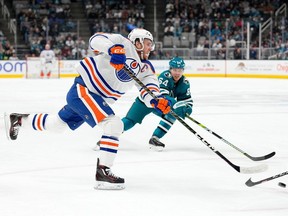 SAN JOSE, CALIFORNIA - DECEMBER 28: Connor McDavid #97 of the Edmonton Oilers shoots on goal against the San Jose Sharks during the first period at SAP Center on December 28, 2023 in San Jose, California.