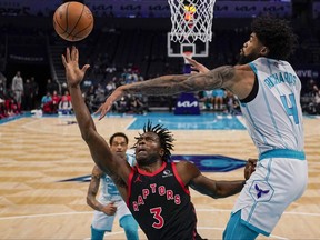 Charlotte Hornets center Nick Richards blocks a shot by Toronto Raptors forward O.G. Anunoby during the first half of an NBA basketball game Friday, Dec. 8, 2023, in Charlotte, N.C.