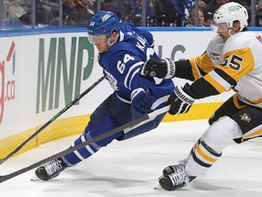 Maple Leafs forward David Kampf, left, in action against Erik Karlsson of the Penguins at Scotiabank Arena in Toronto, Dec. 16, 2023.