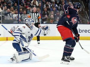 Blue Jackets forward Dmitri Voronkov deflects a shot past Maple Leafs goalie Ilya Samsonov for a goal during second period NHL action at Nationwide Arena in Columbus, Friday, Dec. 29, 2023.