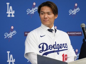 Yoshinobu Yamamoto speaks during his introduction as a new member of the Los Angeles Dodgers baseball team Wednesday, Dec. 27, 2023, in Los Angeles.
