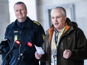 Chief police inspector and operational chief of intelligence service PET, Flemming Drejer (right) and senior police inspector and head of emergency services of Copenhagen Police, Peter Dahl (left) hold a press briefing on a coordinated police action, at the police station in Copenhagen, Thursday, Dec. 14, 2023.