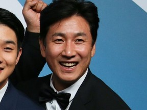 "Parasite" actor Lee Sun-kyun poses with the trophy for Outstanding Performance by a Cast in a Motion Picture in the press room during the 26th Annual Screen Actors Guild Awards at the Shrine Auditorium in Los Angeles on Jan. 19, 2020.
