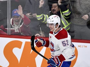 Justin Barron of the Montreal Canadiens celebrates his game-winning goal against the Winnipeg Jets in overtime during NHL action in Winnipeg on Dec. 18, 2023.