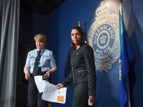 Queensland Police Service Assistant Commissioner Cheryl Scanlon and Federal Bureau of Investigation representative Nitiana Mann, right, leave after speaking to the media during a press conference at Queensland Police Service Headquarters in Brisbane, Australia, Wednesday, Dec. 6, 2023. A U.S. citizen has been charged in Arizona over online comments that allegedly incited what police describe as a "religiously motivated terrorist attack" in Australia a year ago in which six people died, officials said Wednesday.