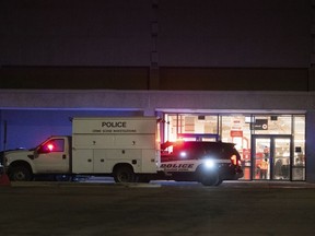 Colorado Springs Police Department investigators continue working the scene at Citadel Mall in Colorado Springs, Colo., late Christmas Eve after authorities said a fatal shooting occurred at the shopping center, Sunday, Dec. 24, 2023.