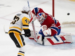 Penguins' Jansen Harkins scores the winner past Canadiens goaltender Sam Montembeault during the 12th round of a shootout Wednesday night at the Bell Centre.