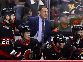 Ottawa Senators interim head coach Jacques Martin stands behind the bench during first period NHL hockey action against the Pittsburgh Penguins in Ottawa, on Saturday, Dec. 23, 2023.