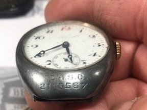 World War II veteran William "Bill" Bessent, 98, of Grande Prairie, wears the engraved silver watch that was worn in the First World War by his father, Herbert Bessent, Sr. The 106-year-old watch was lost to the family for many decades, until it was found in a thrift store bag of watch parts by Edmonton resident Jean Guy Charest and returned to the family this week.