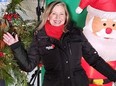 Global News Morning Calgary traffic reporter Leslie Horton smiling with Christmas-themed background.