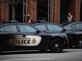 Police cars are seen parked outside Vancouver Police Department headquarters in Vancouver, on Saturday, January 9, 2021.