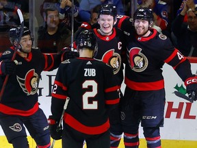 Brady Tkachuk of the Ottawa Senators celebrates with teammates after scoring his second goal of the night against the New York Rangers on Tuesday night at the Canadian Tire Centre in Ottawa.