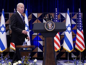 President Joe Biden walks to the podium to deliver remarks on the war between Israel and Hamas after meeting Israeli Prime Minister Benjamin Netanyahu, Wednesday, Oct. 18, 2023, in Tel Aviv.